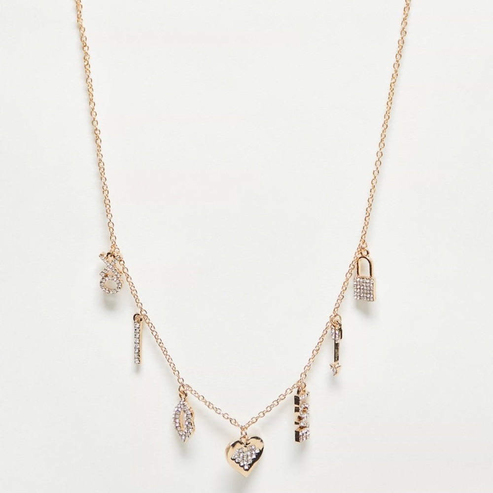 ALDO Bow and Arrow multi charm necklace
